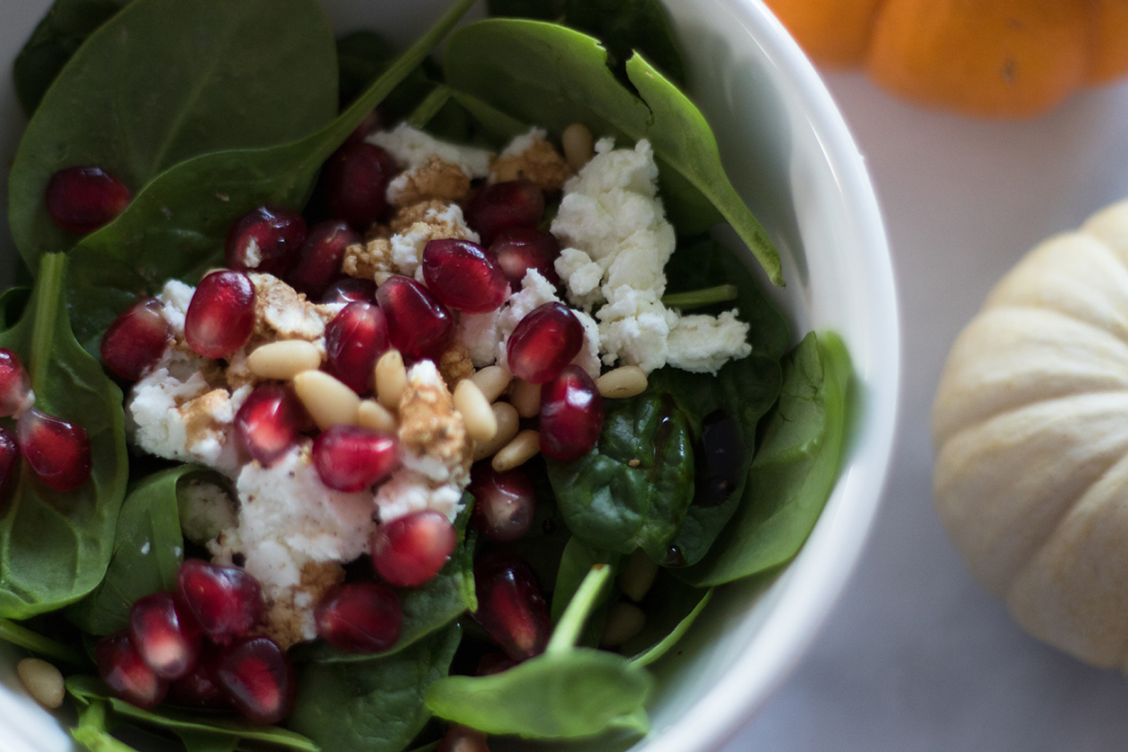 Pomegranate goat cheese spinach salad_close up_on joyfetti.com