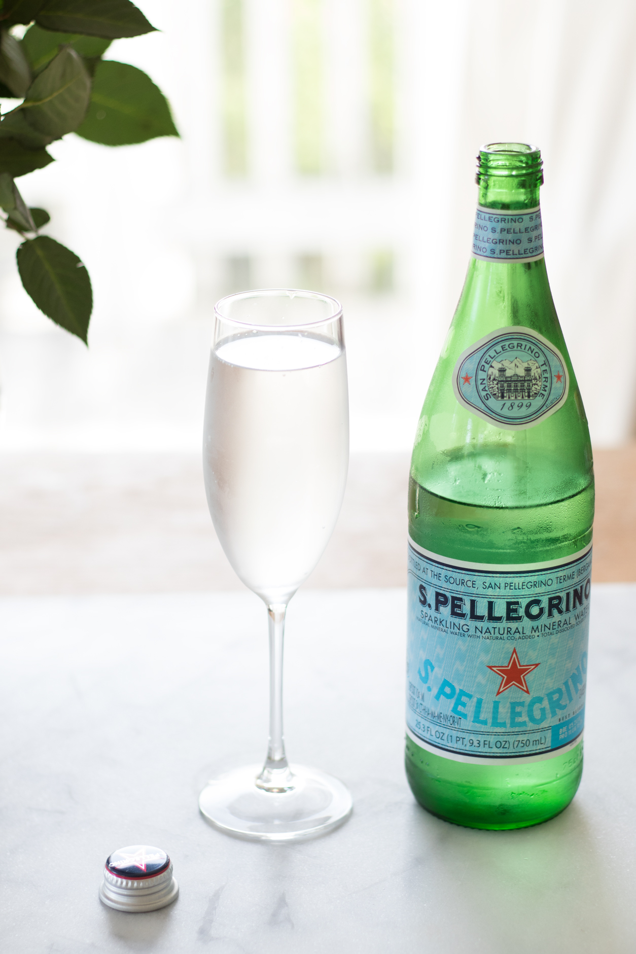 How to drink more water_Pellegrino, champ glass, cap